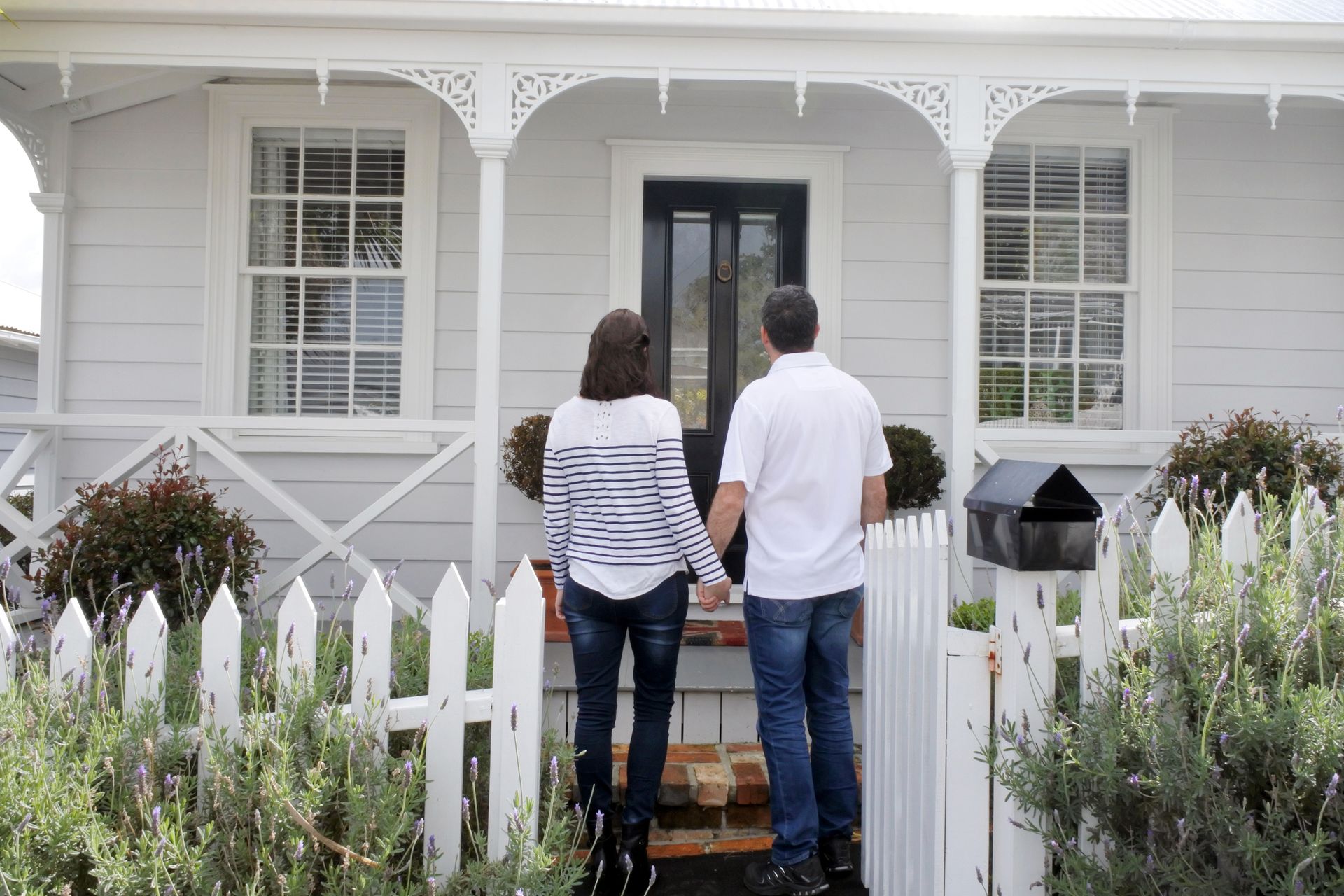 Couple In Front Of House — Christchurch, NZ — Money For You Mortgages