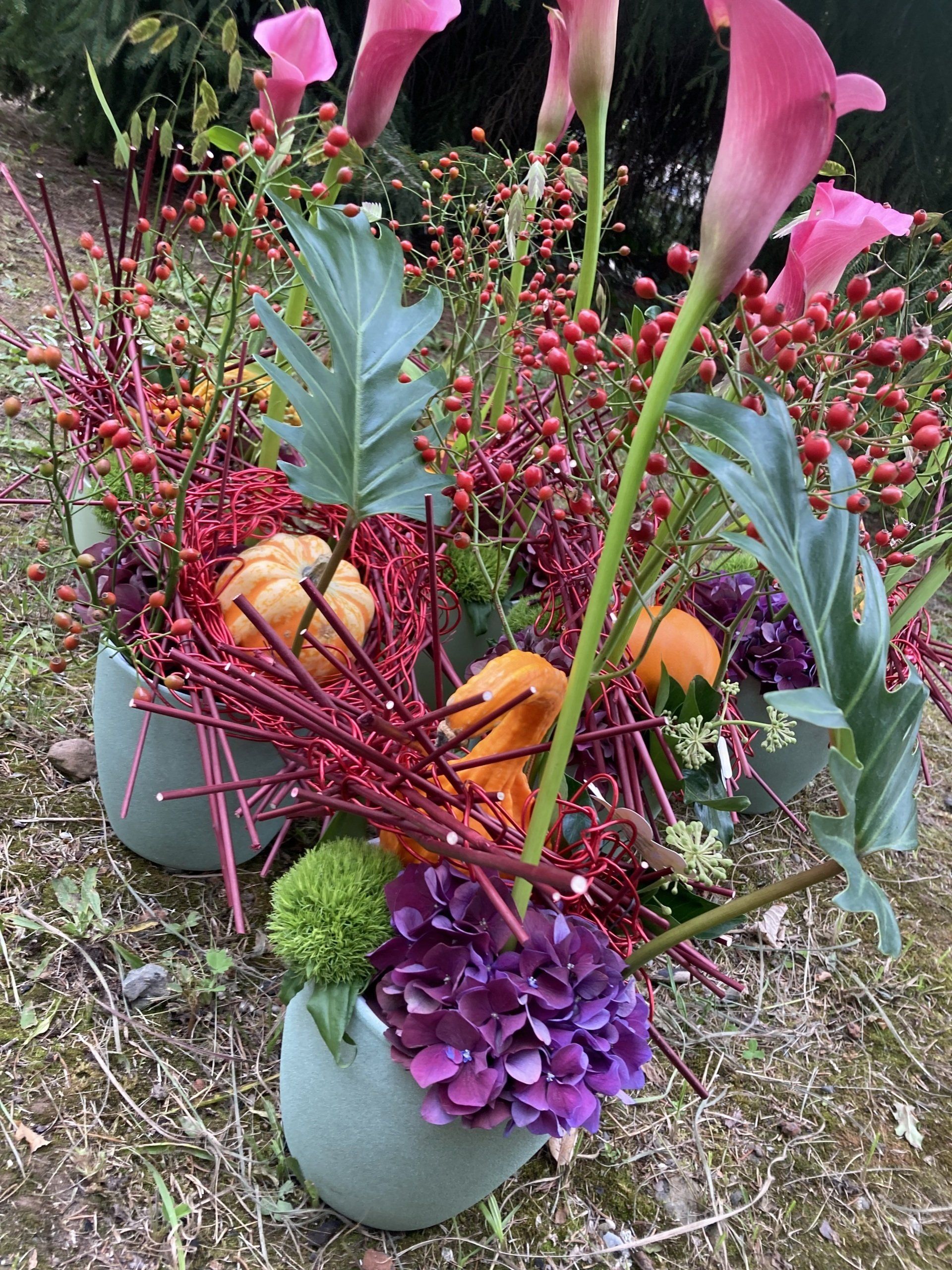Komposition mit kleinen Kürbissen
