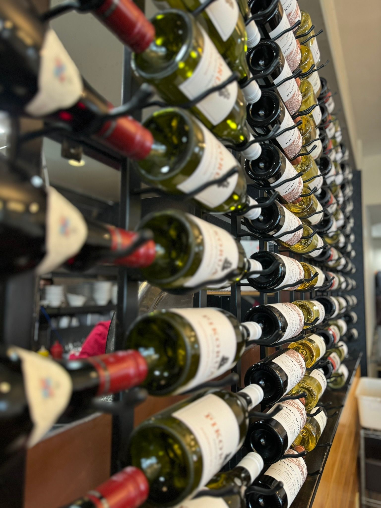 A row of wine bottles stacked on top of each other