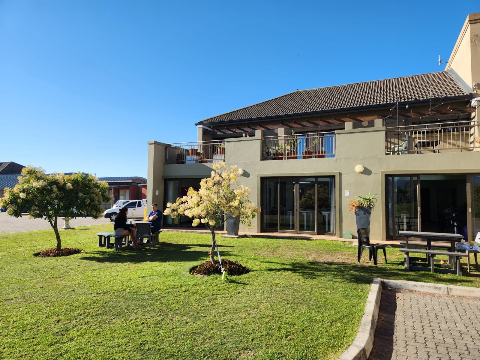 a bedroom with two beds and a desk