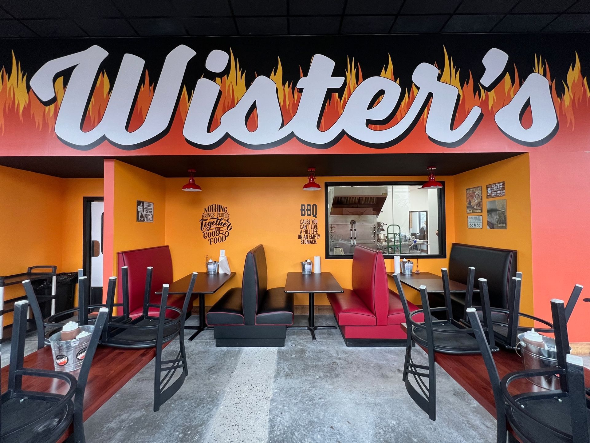 A restaurant with tables and chairs and a sign that says wister 's