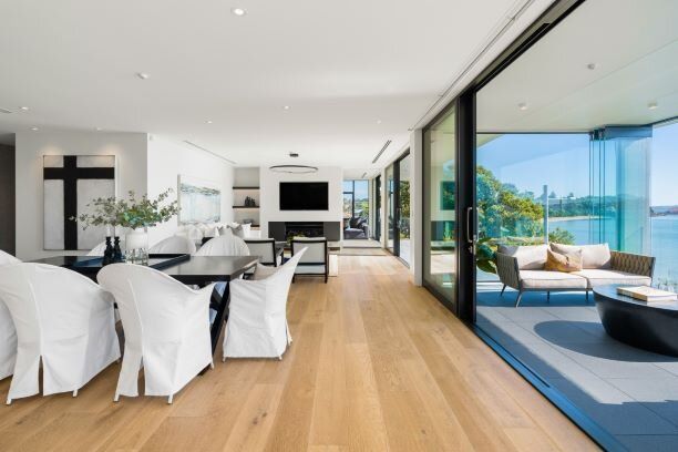 A living room with hardwood floors and sliding glass doors