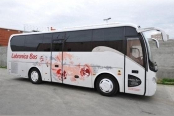Full view of the side of the coach with full pink and red design