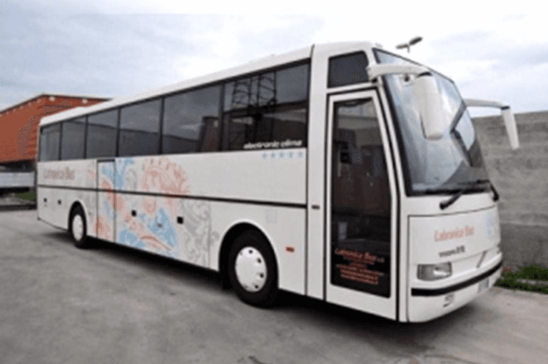 White coach with blue, grey and orange design on the side