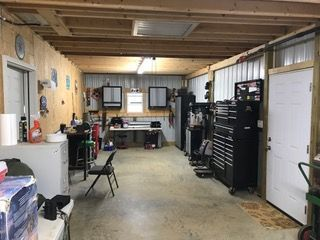 A large garage filled with lots of tools and equipment.