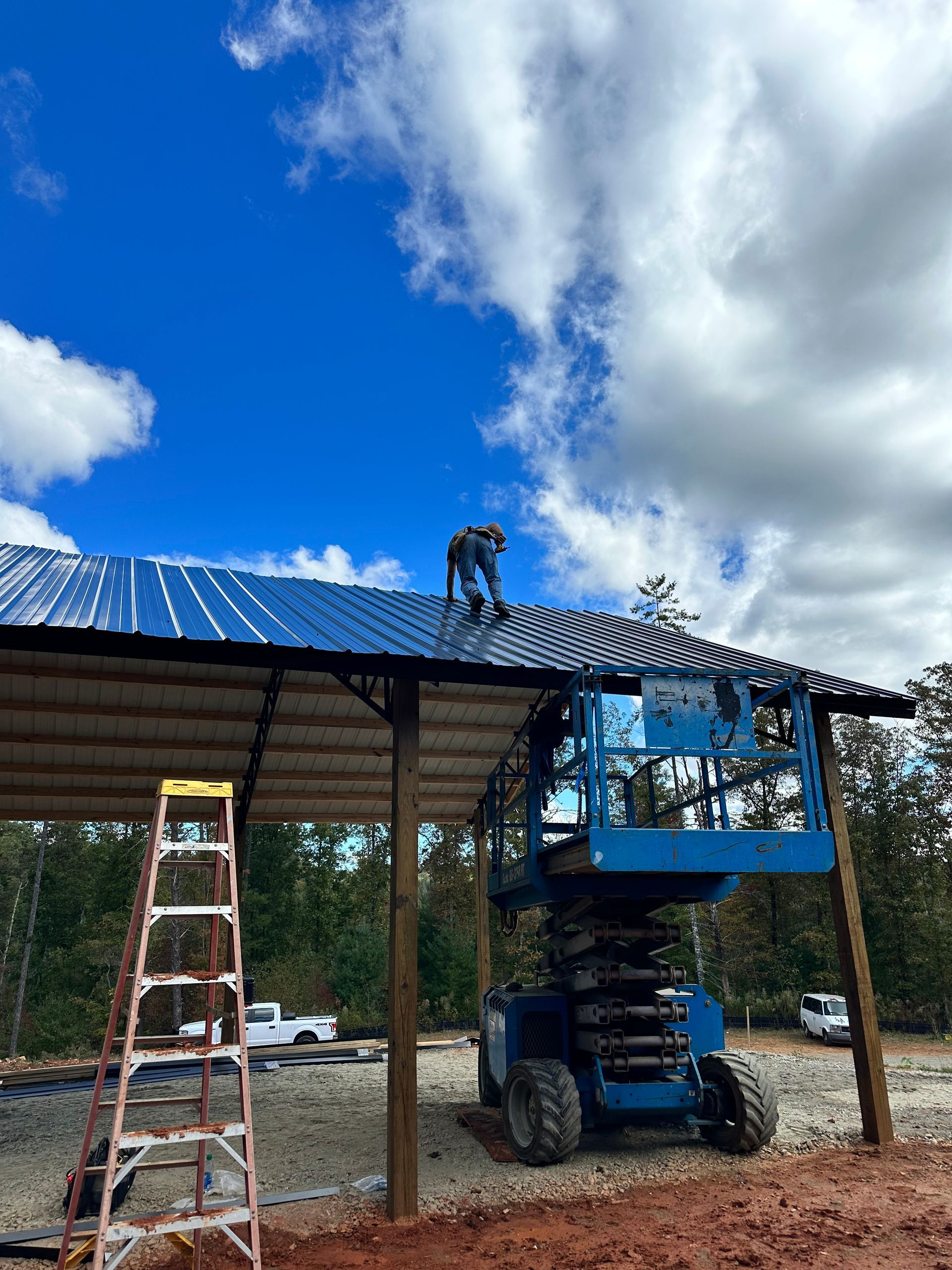 A man is working on the roof of a building.
