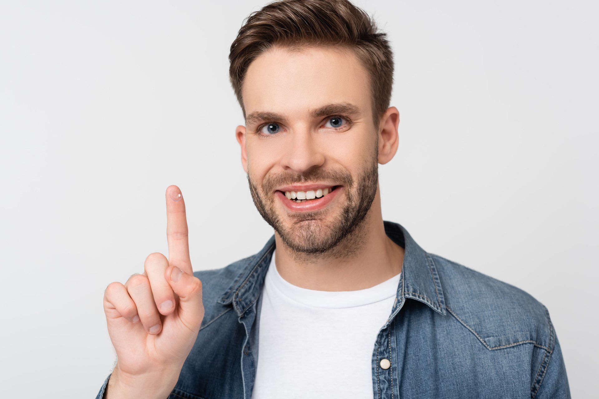 Man Holding Contact Lens — Middlebury, IN — Quality Optical