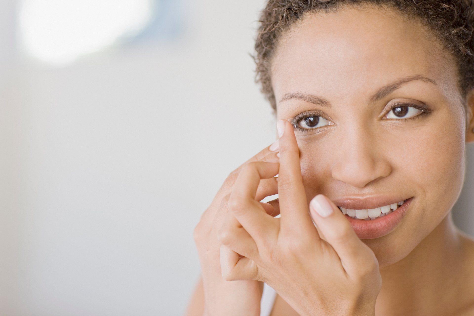 Woman Wearing Contact Lens — Middlebury, IN — Quality Optical