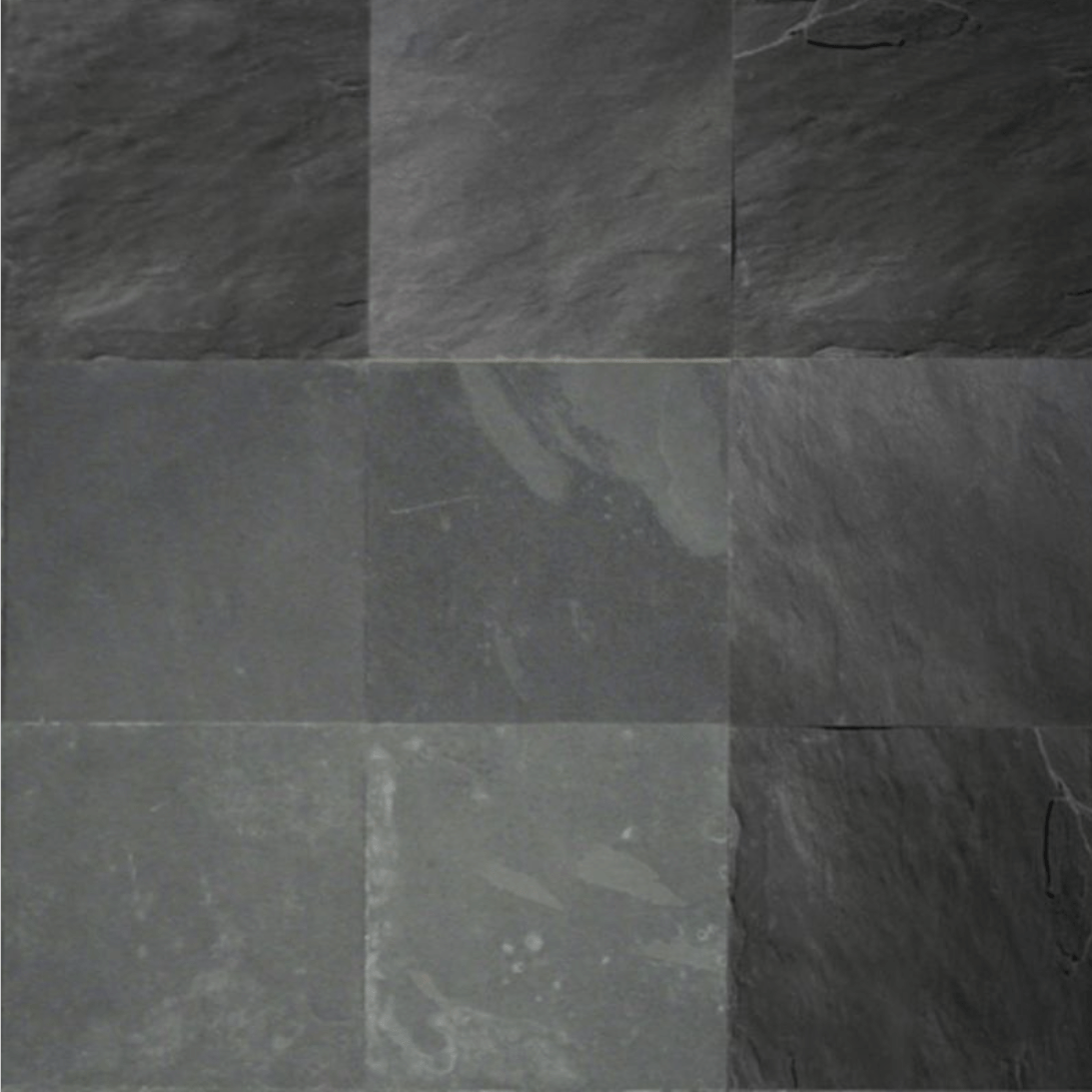 Un primer plano de un piso de baldosas negras con un patrón de cuadros.