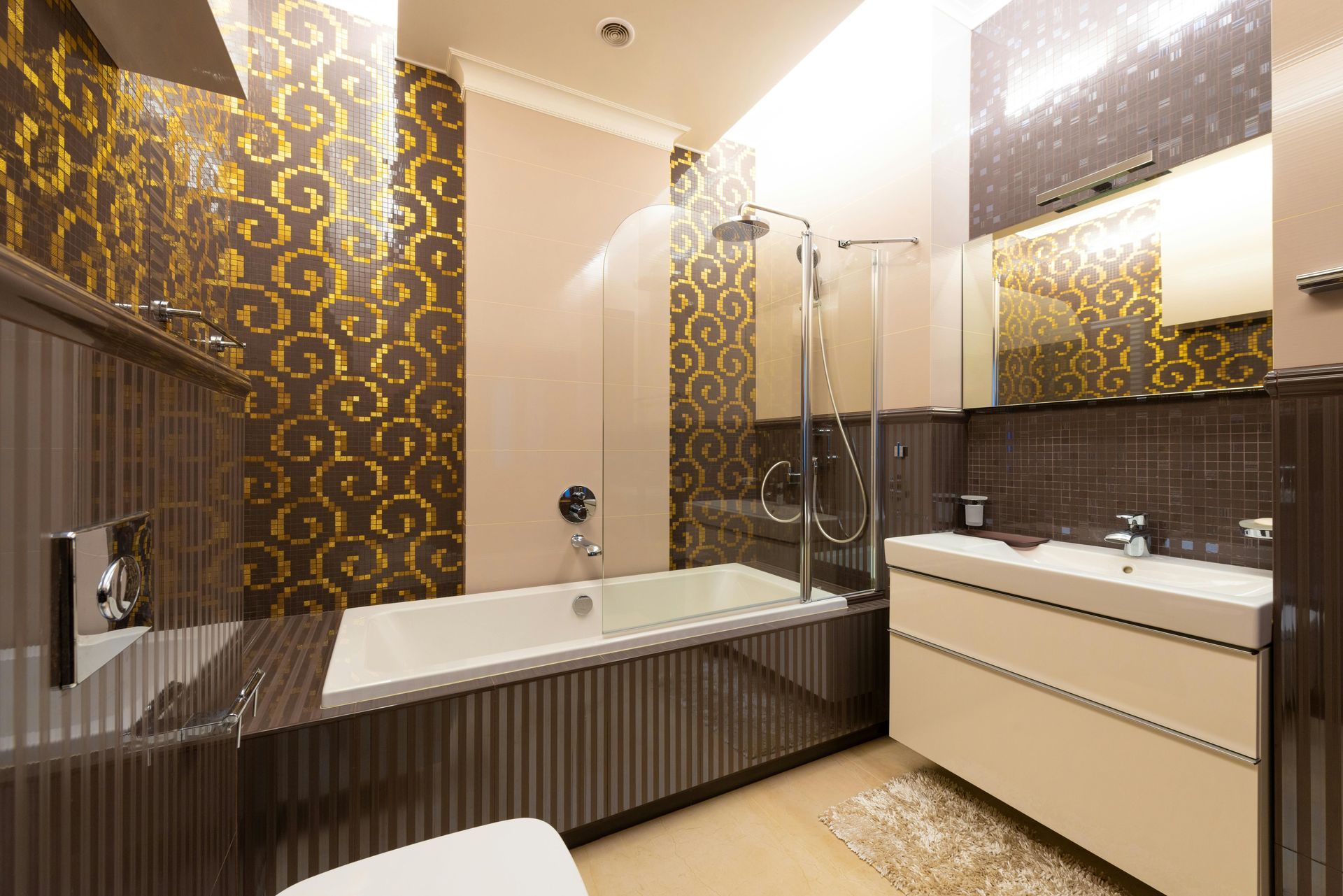 A bathroom with a bathtub , sink , toilet and shower.