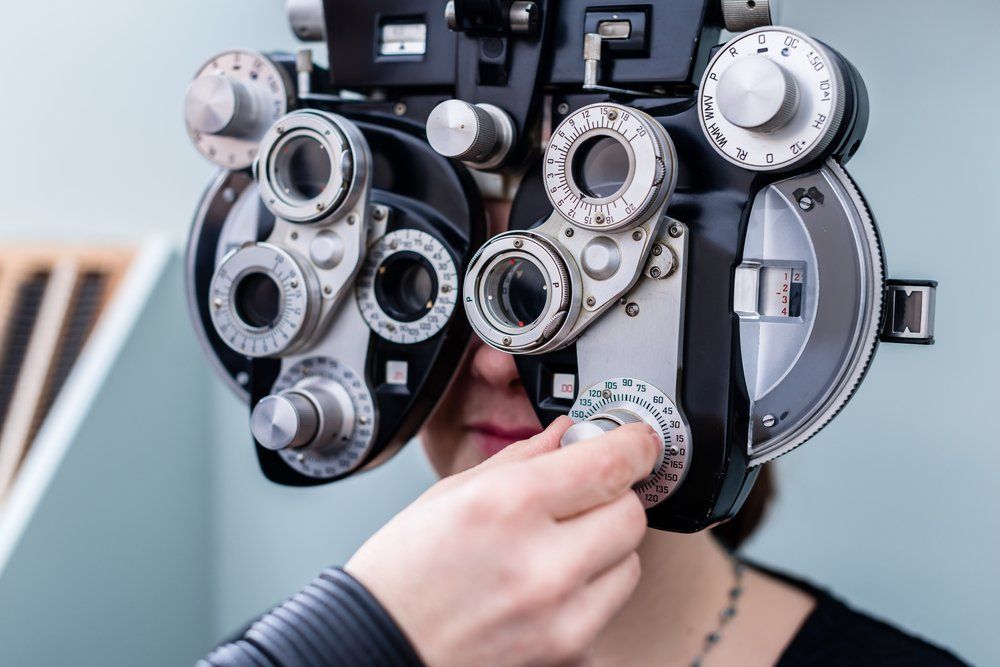 Optometrist Checking the Eye Grade of Patient — John Williams Optometrist in Grafton, NSW