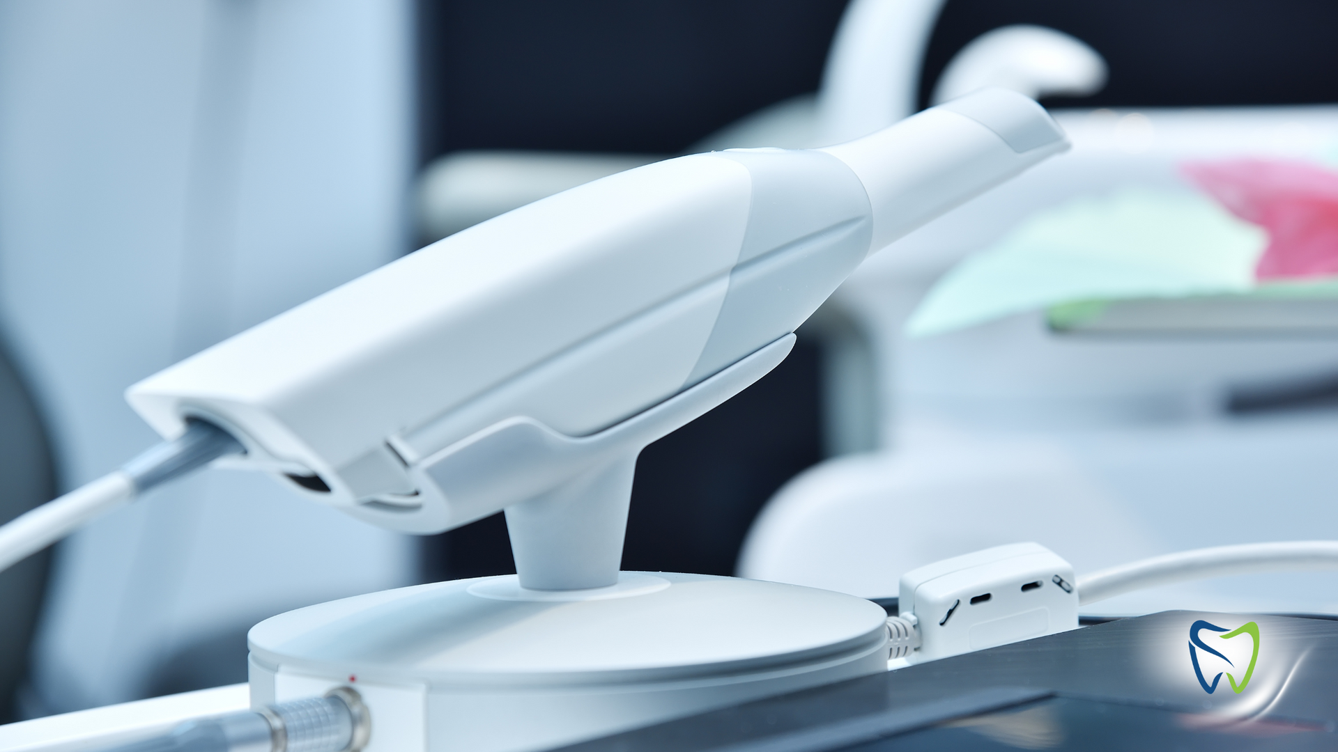 A white camera is sitting on top of a table in a dental office.