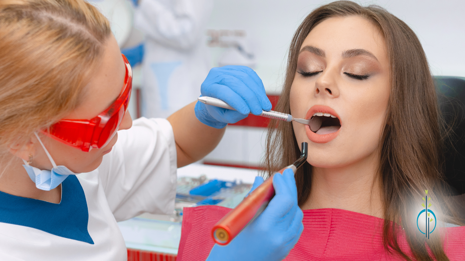 A woman is getting her teeth examined by a dentist.