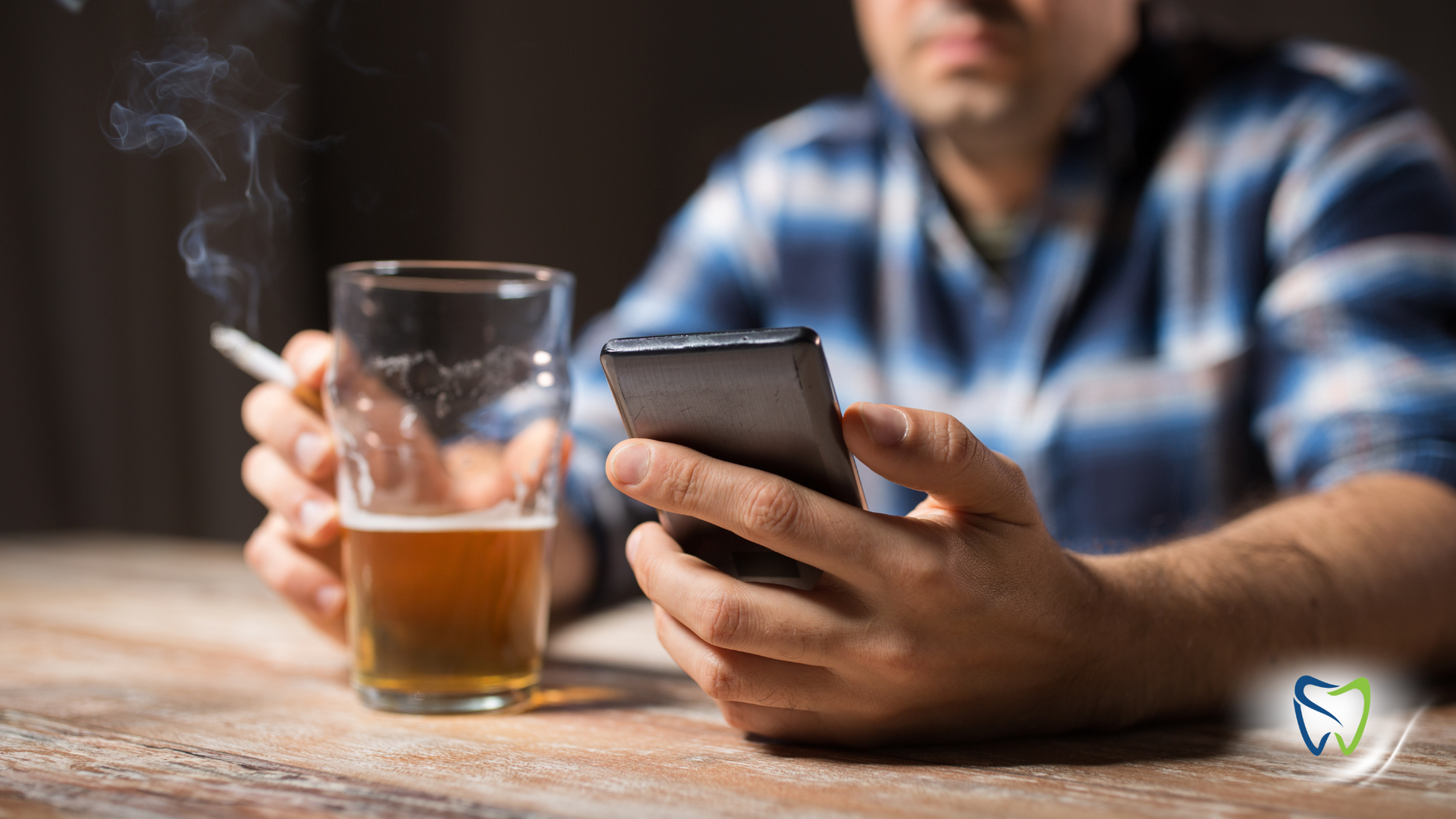 Man smoking and drinking