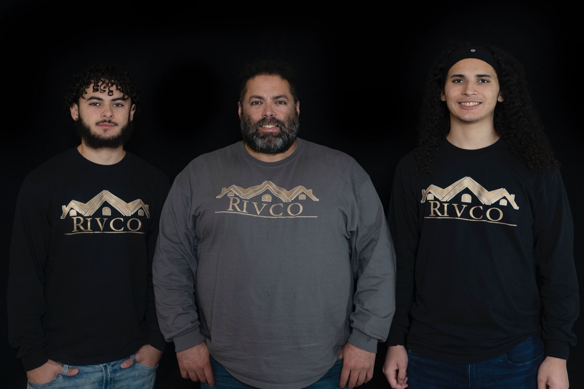 Three people are standing next to each other wearing shirts that say rivco.