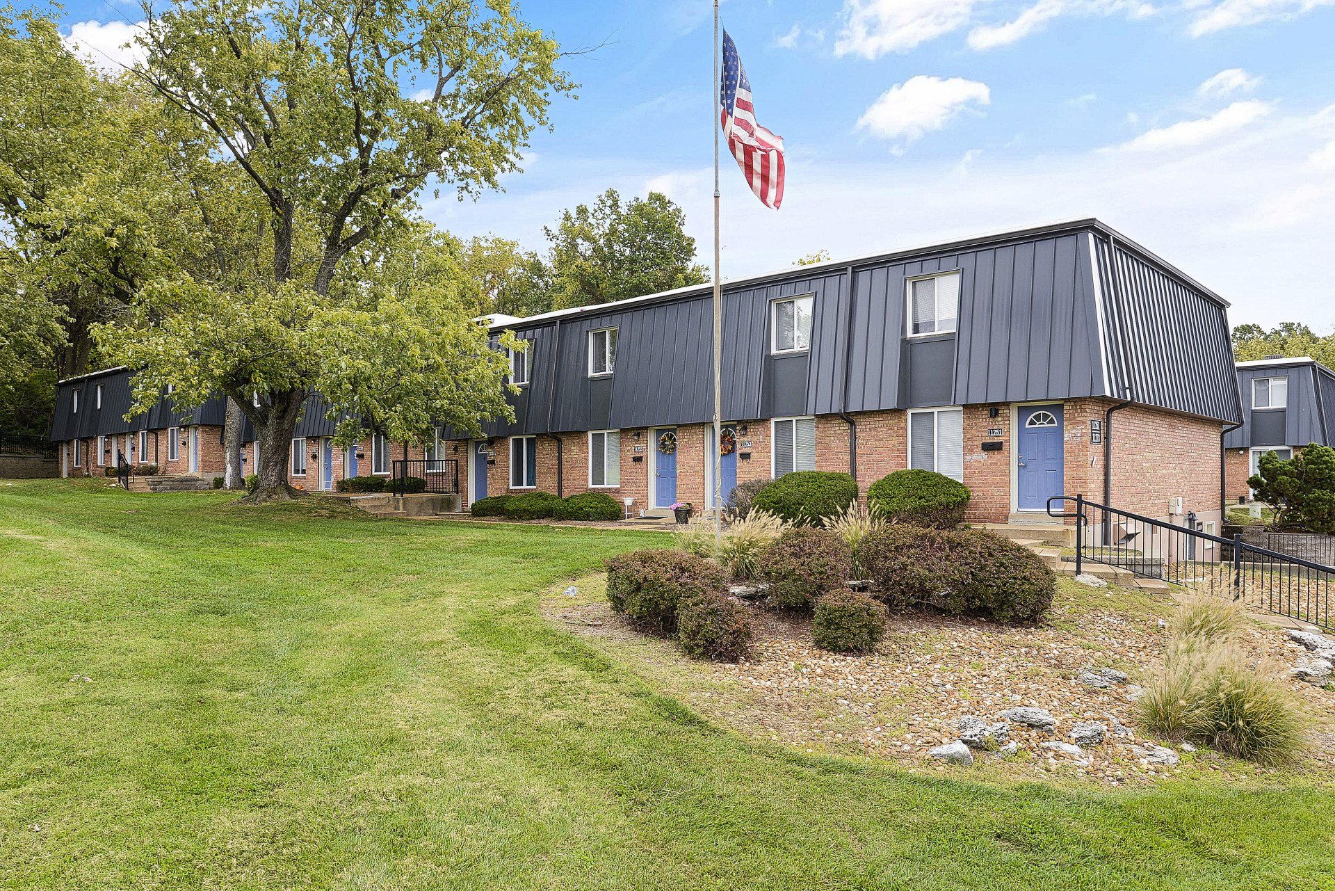 Exterior of Westport Crossing Apartments with large grass area
