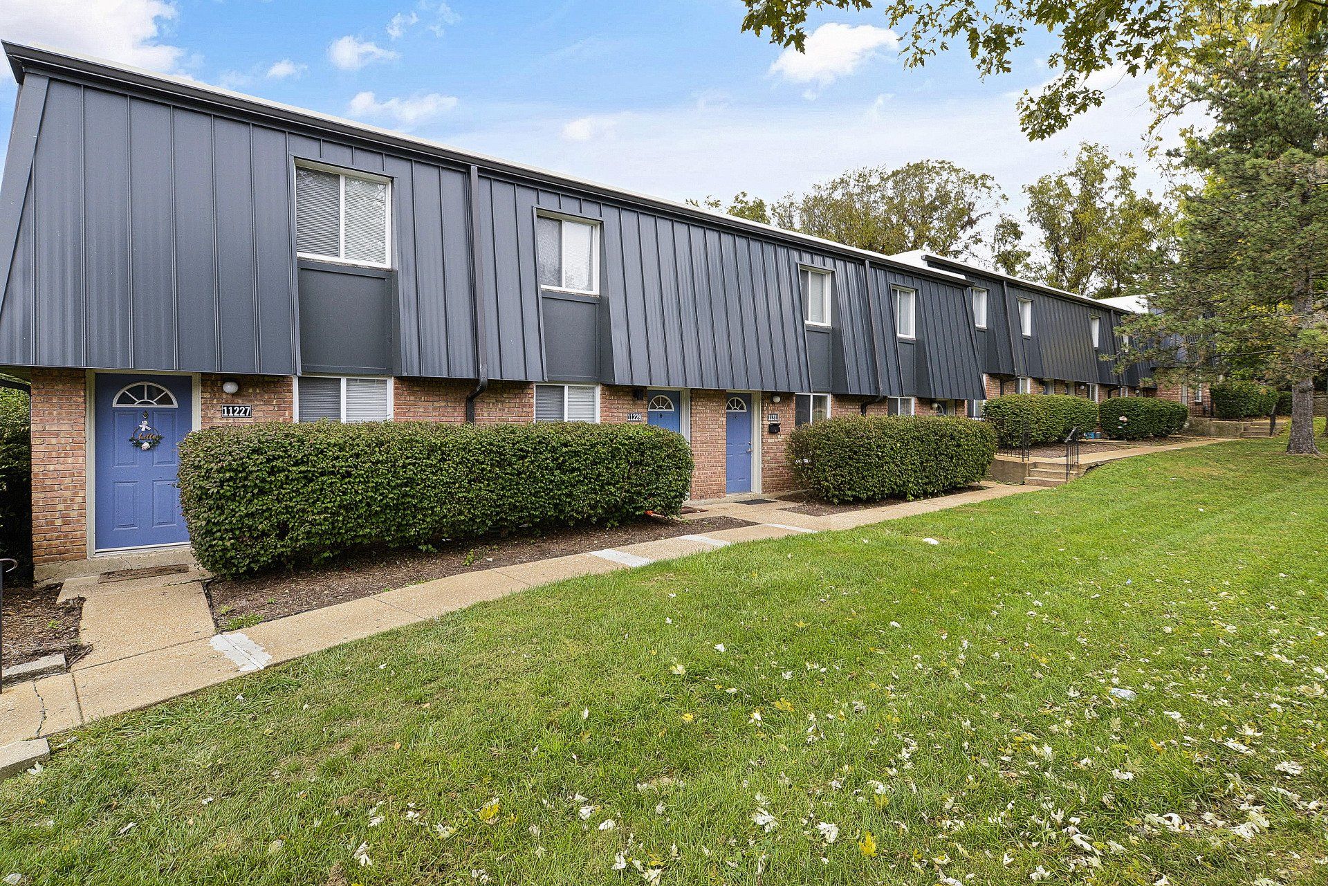 Exterior of Westport Crossing Apartments with large grass area