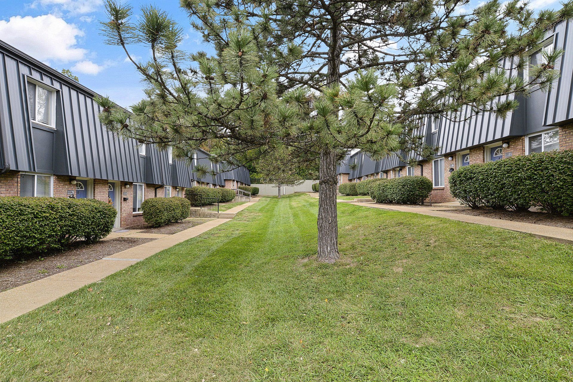 Exterior of Westport Crossing Apartments with large grass area