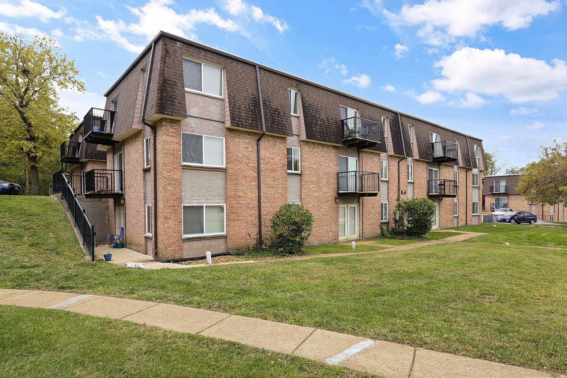 Exterior of Westport Crossing Apartments with large grass area
