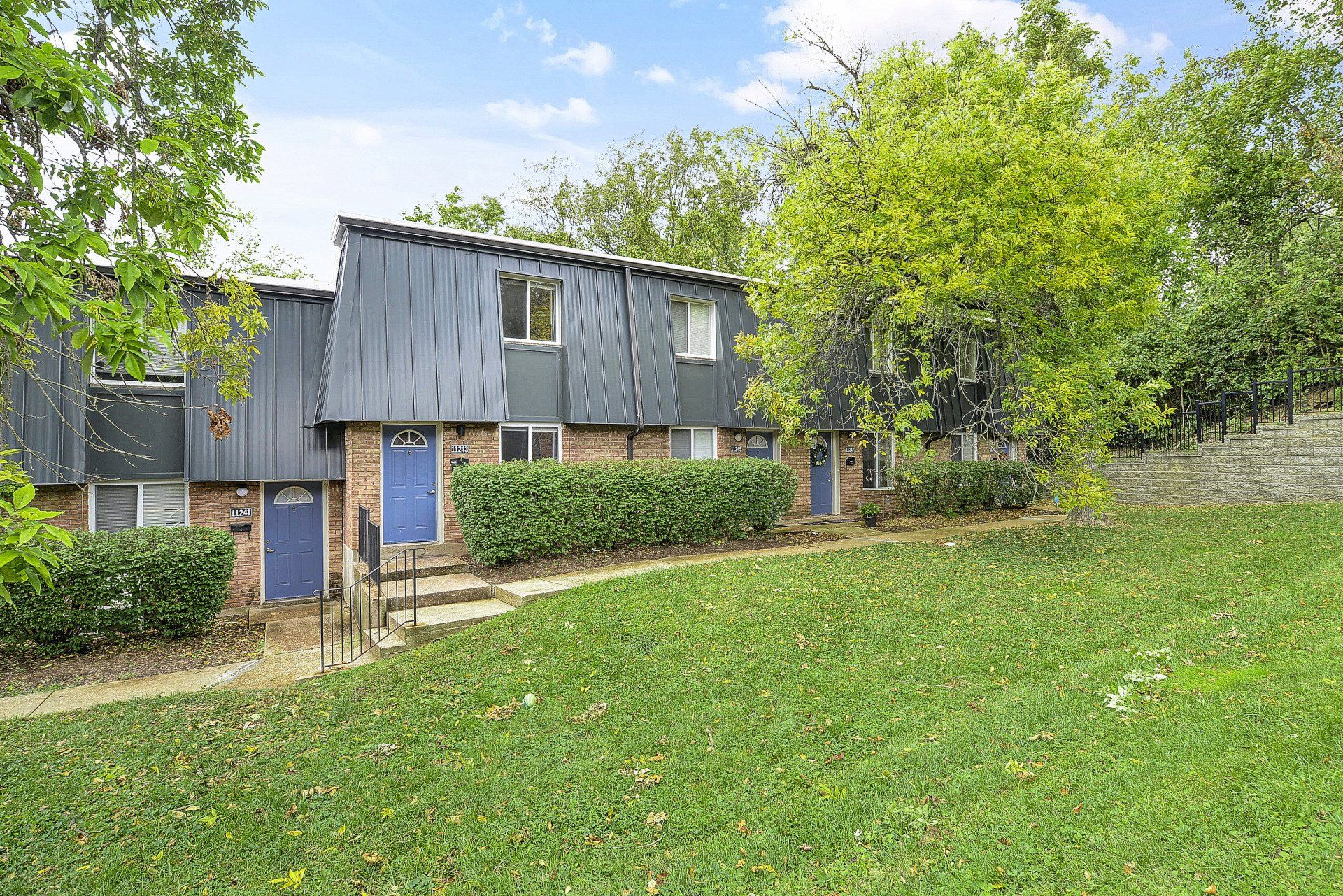 Exterior of Westport Crossing Apartments with large grass area