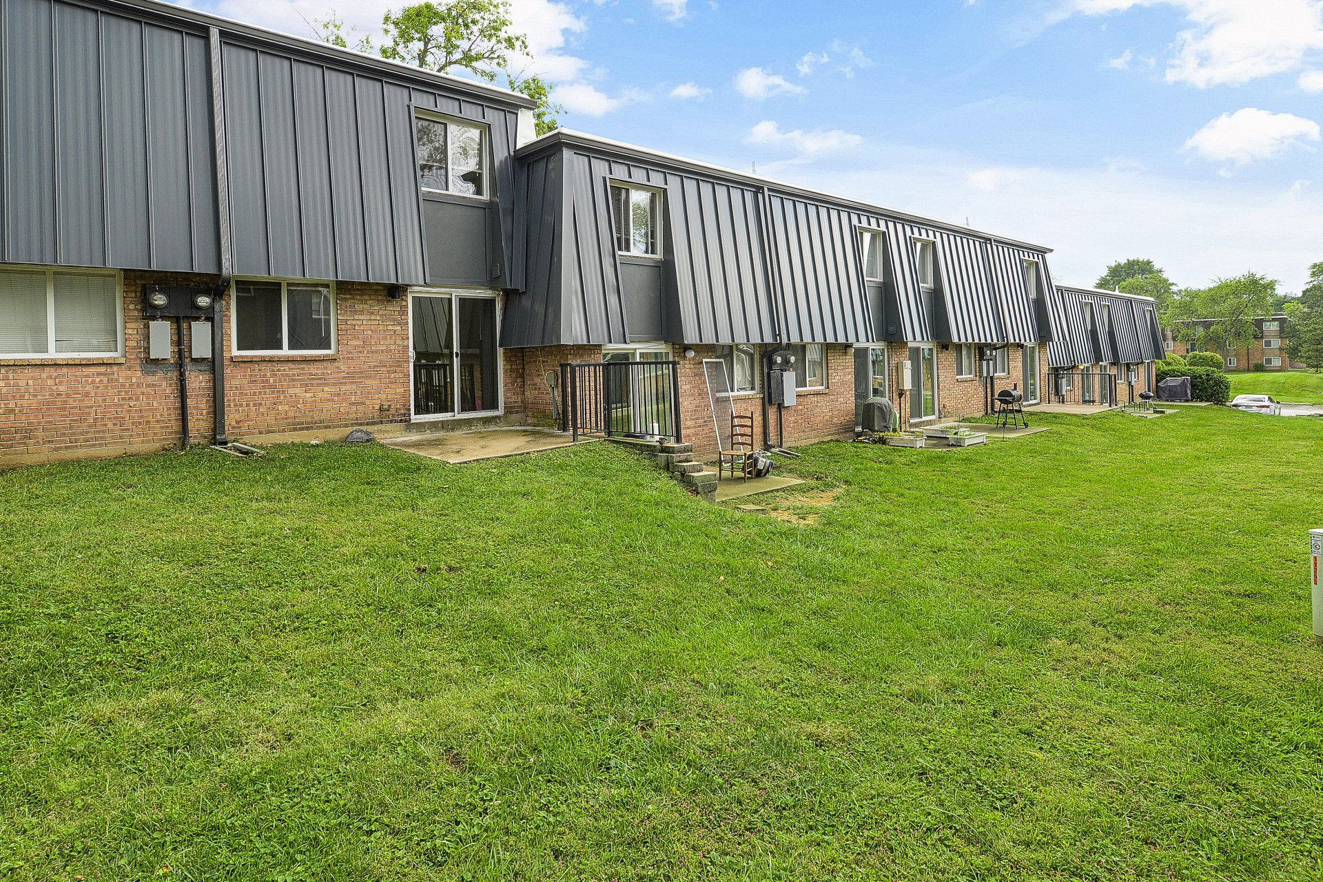 Exterior of Westport Crossing Apartments with large grass area