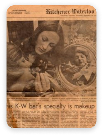 Newspaper clipping: Woman applying makeup, reflected in a mirror. Headline: 