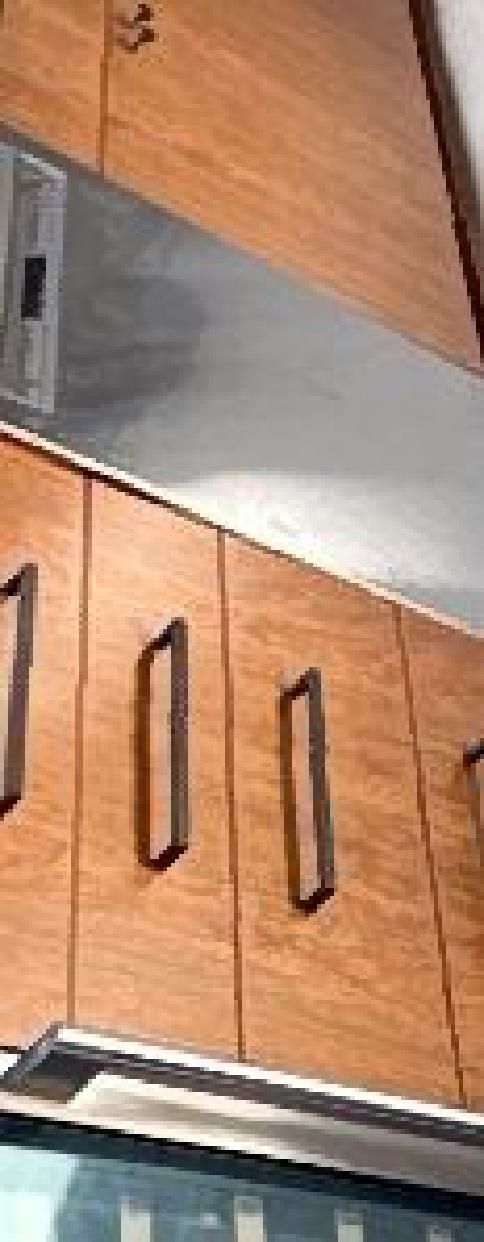 A kitchen with wooden cabinets and stainless steel appliances.