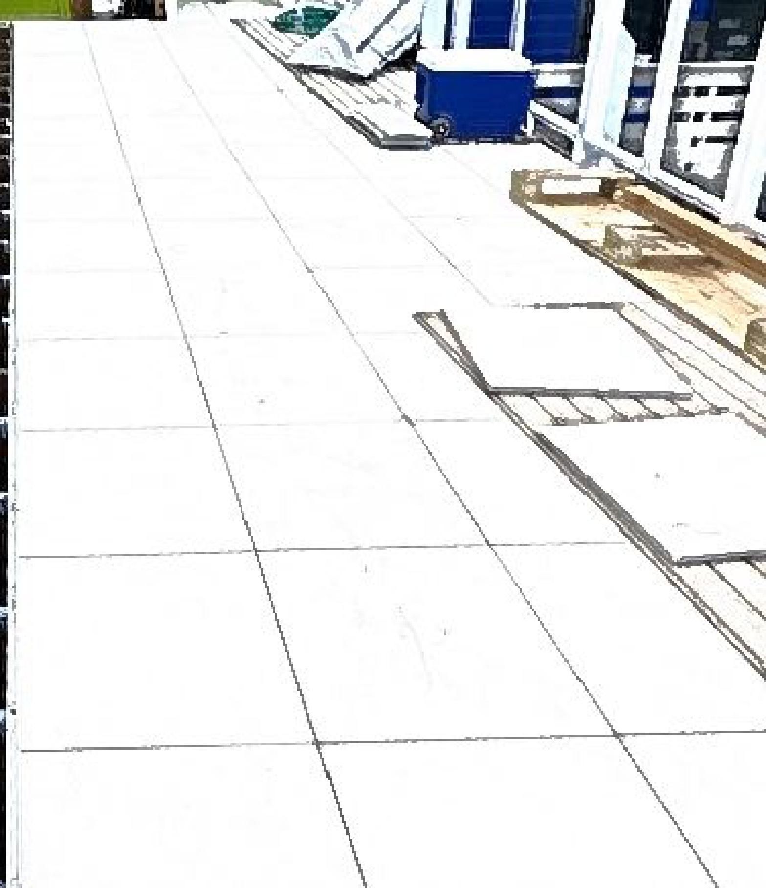 A white tiled deck with a blue cooler on top of it.