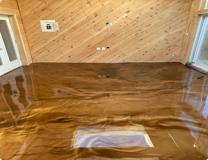 A living room with a wooden wall and a shiny floor.