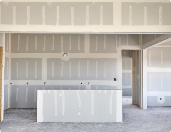 An empty room with drywall on the walls