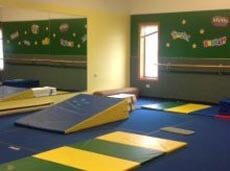 Gymnast Service — Gymnastic Room With Blue Mat in Greensburg, PA