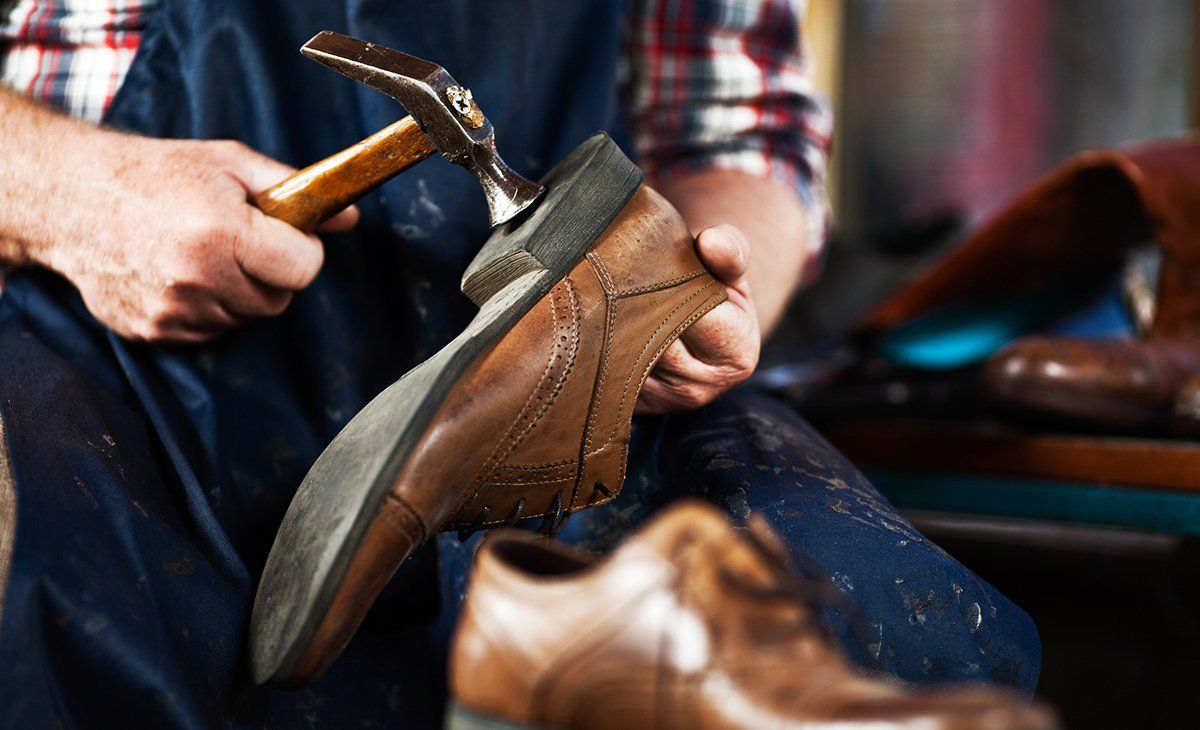 Person Doing Shoe Repair — Arlington, TX — Bond Cleaners