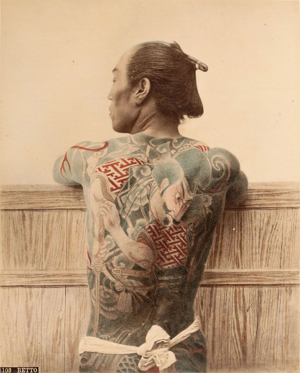 Italian photographer Adolfo Farsari captured this portrait of a tattooed horse groom around 1886. A warrior figure is clearly illustrated on the groom’s upper back. Via Pitt Rivers Museum.