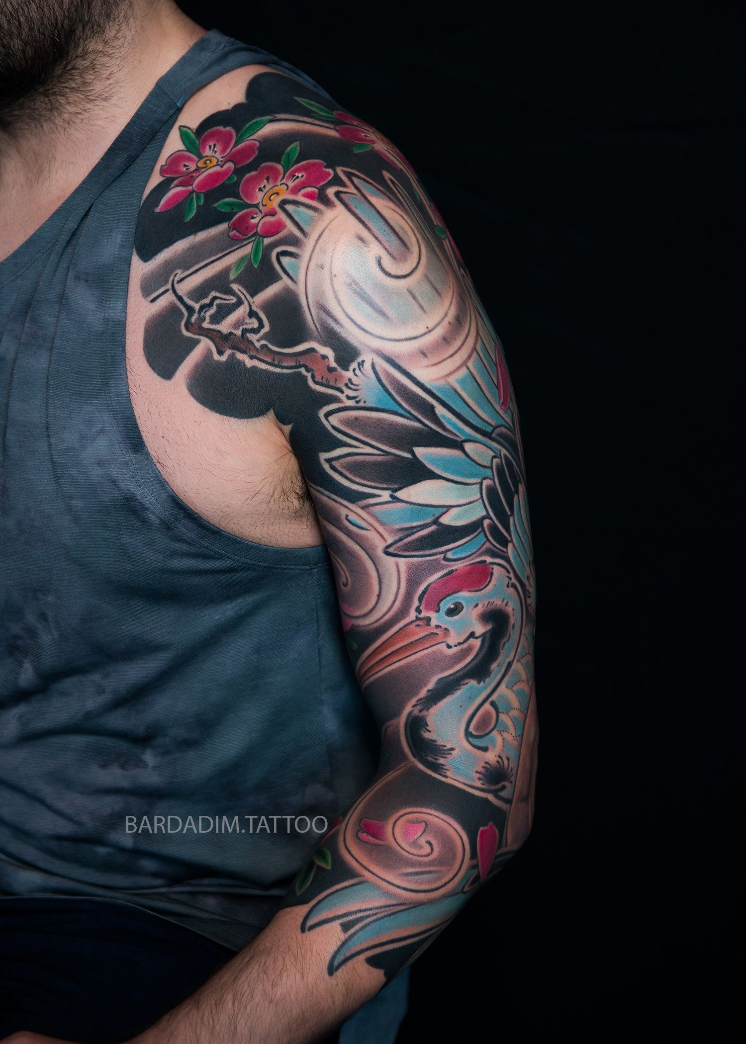 Crane and cherry blossoms tattoo sleeve