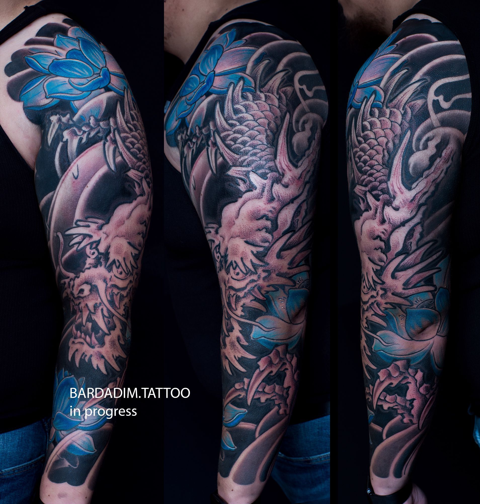A man has a full sleeve tattoo of a dragon on his arm.