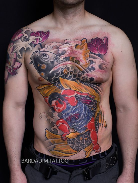A man has a tattoo of a fish and a man on his chest. Nuki-Bori tattoo by George Bardadim