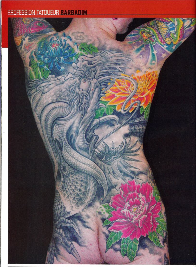 A woman with a lot of tattoos on her back