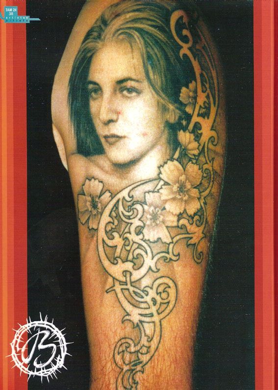 A tattoo of a woman with the letter b on it