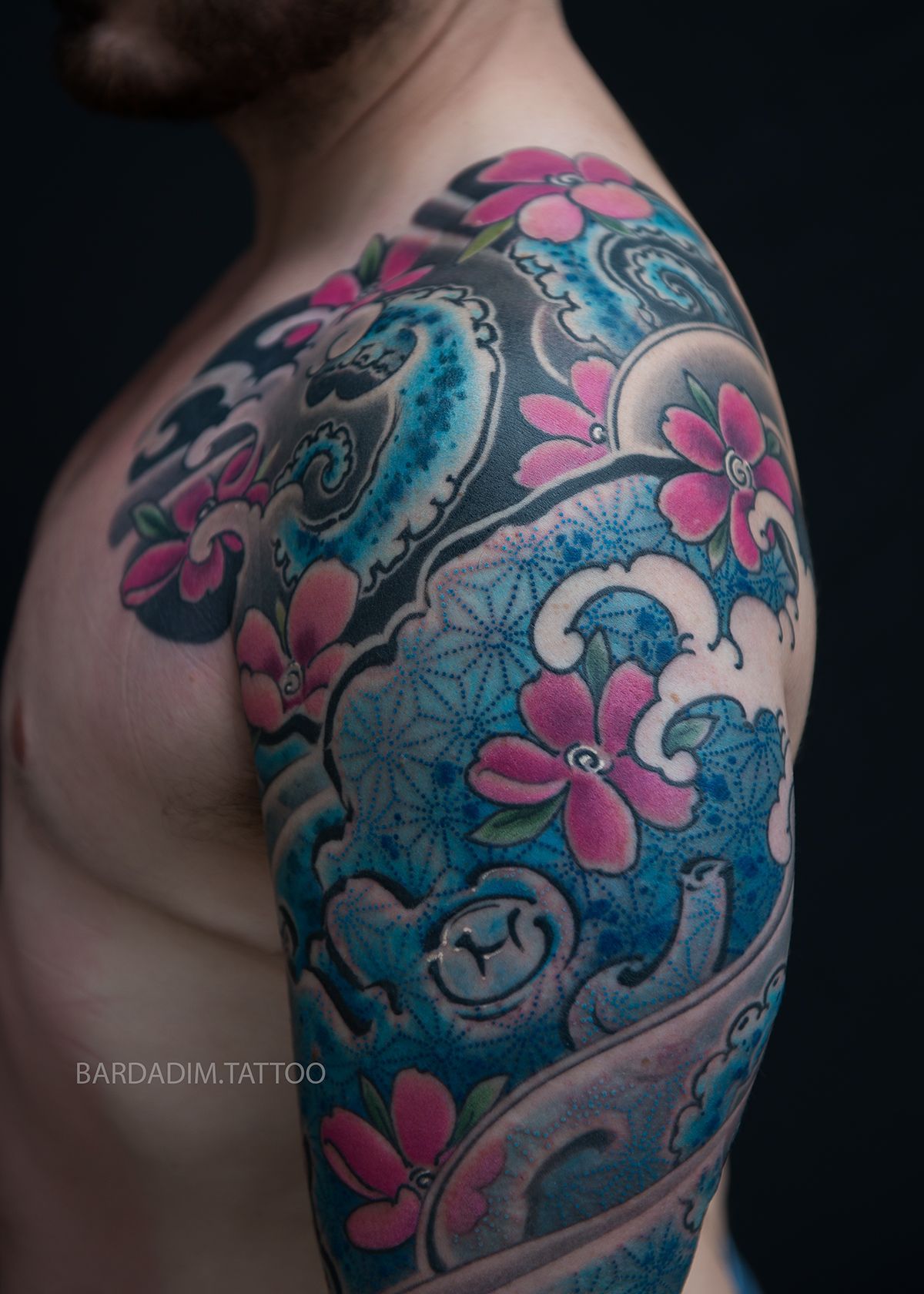 Blue octopus and cherry blossoms tattoo sleeve
