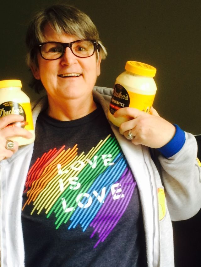 A person wearing glasses and a rainbow 