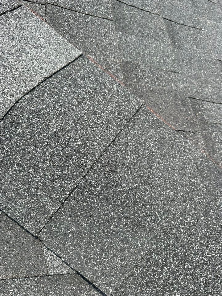 A close up of a gray tile floor.