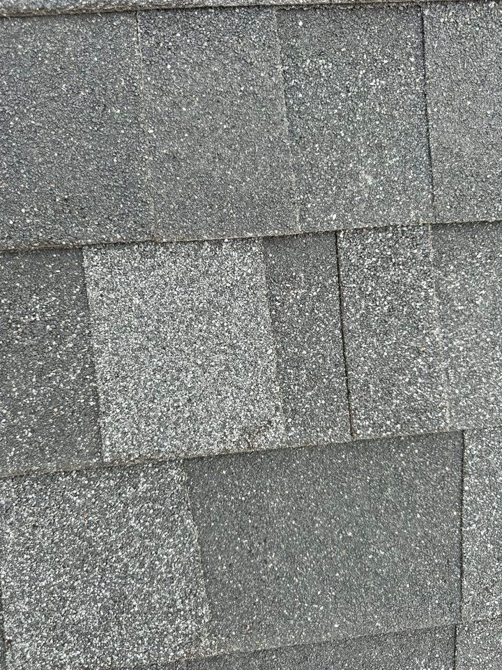 A close up of a roof with shingles on it.