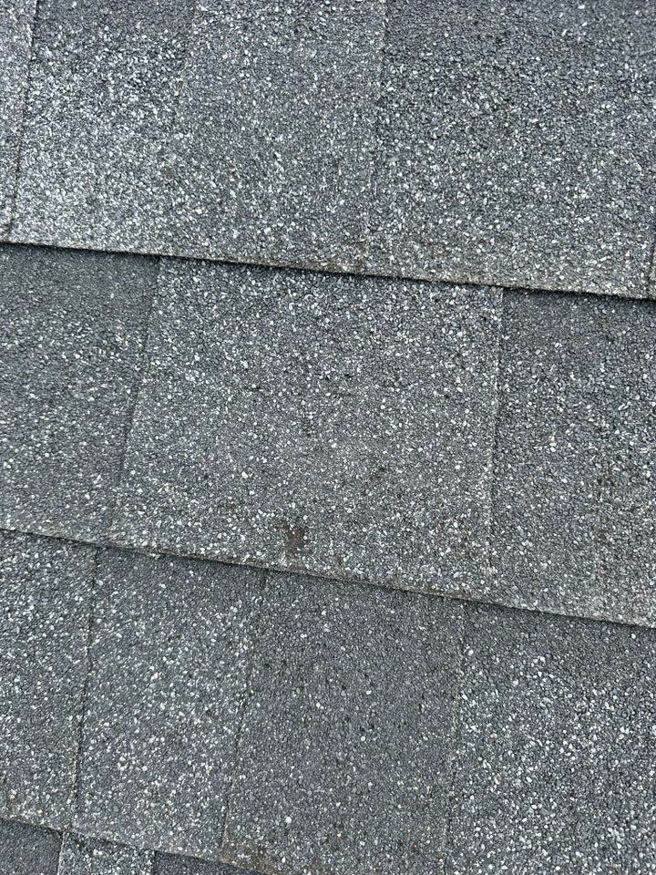 A close up of a roof with shingles on it.