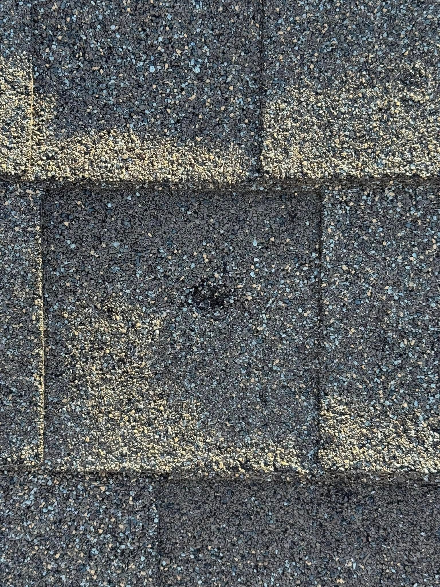 A close up of a roof with a hole in it.
