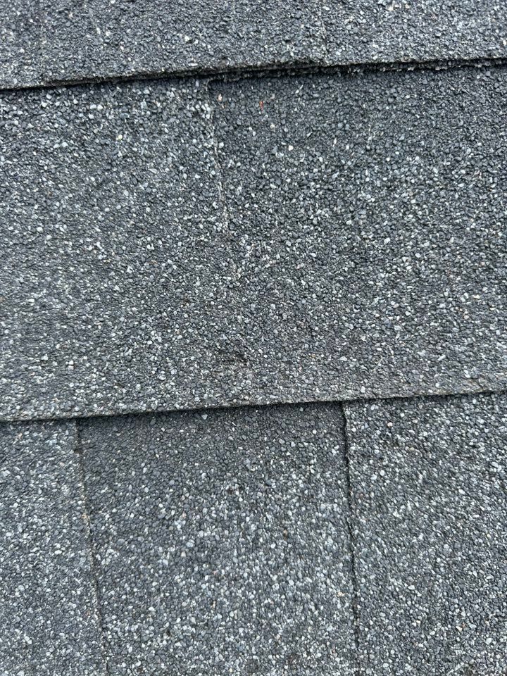 A close up of a roof with shingles on it.
