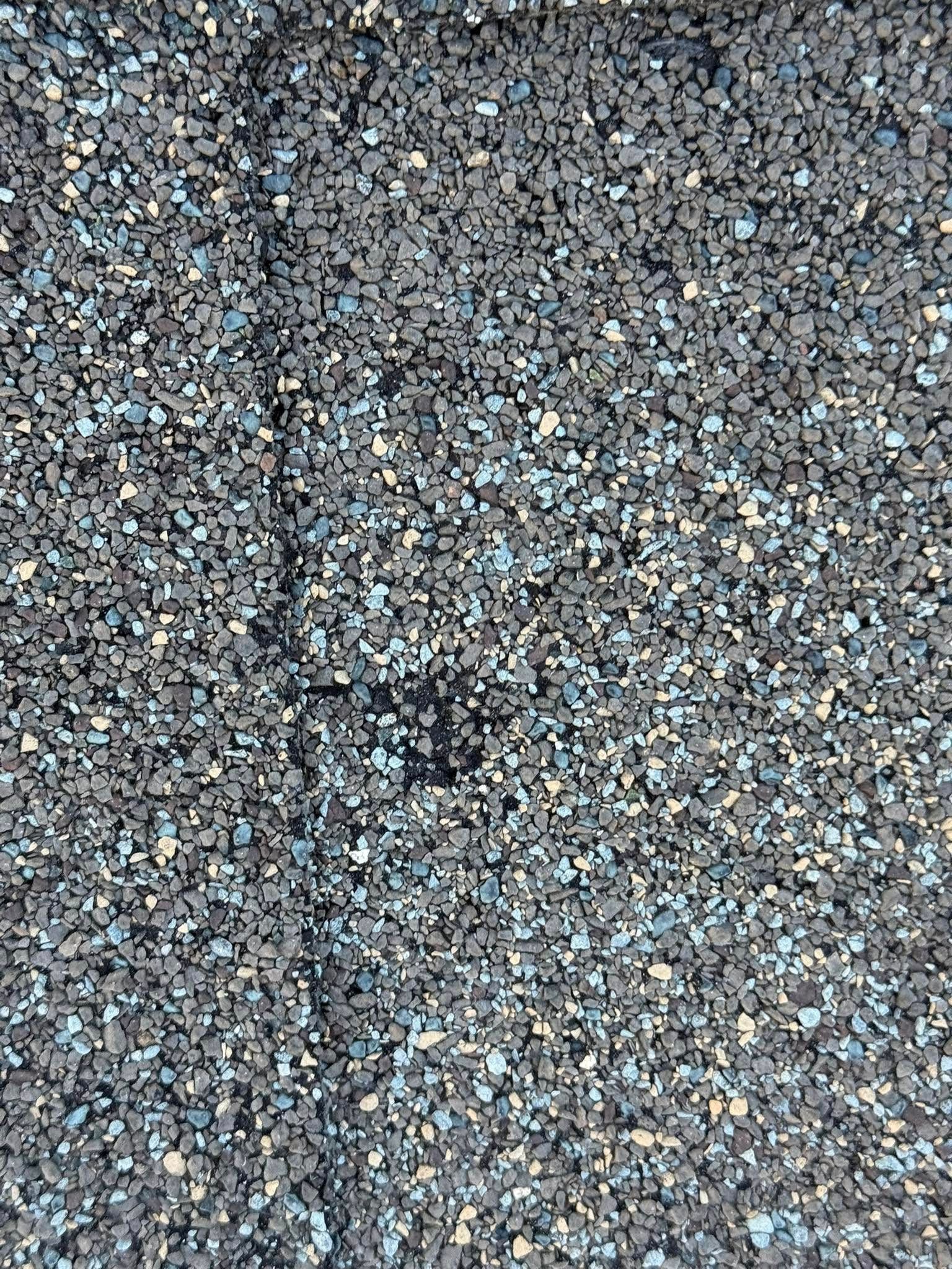 A close up of a pile of gravel on the ground.
