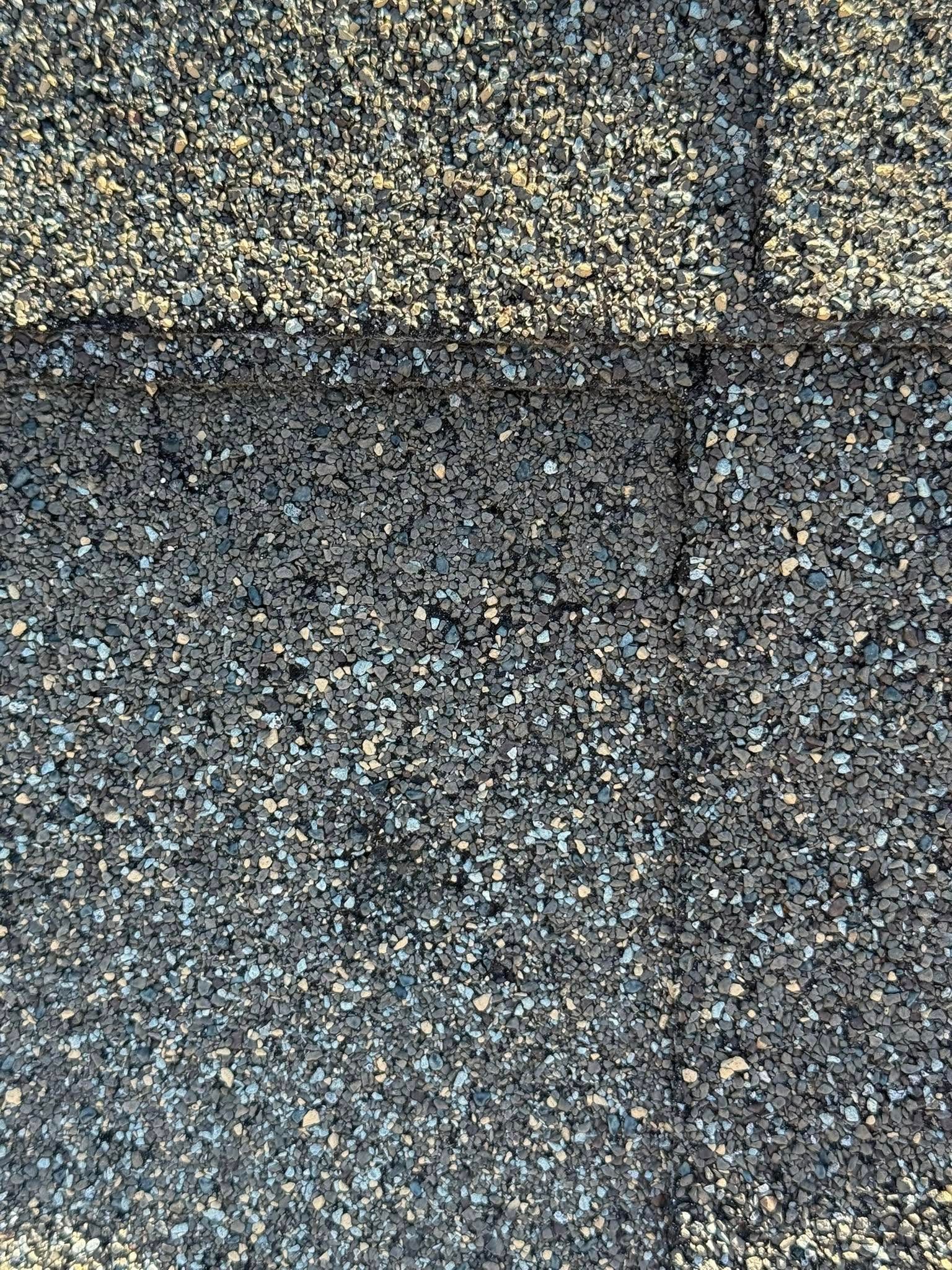 A close up of a roof with shingles on it.