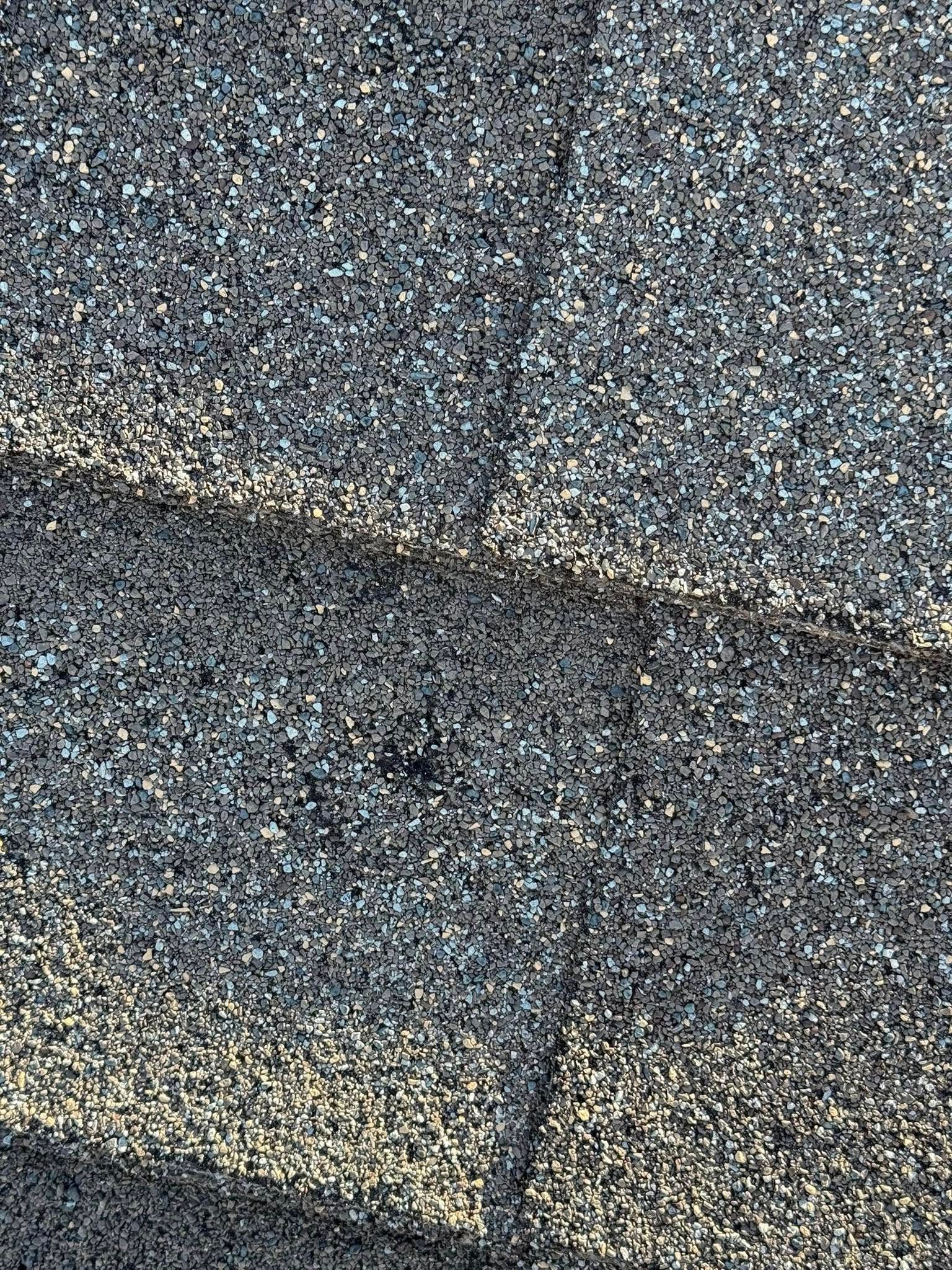 A close up of a roof with shingles on it.