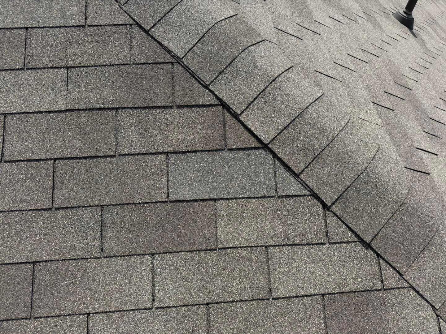 A close up of a roof with shingles on it.