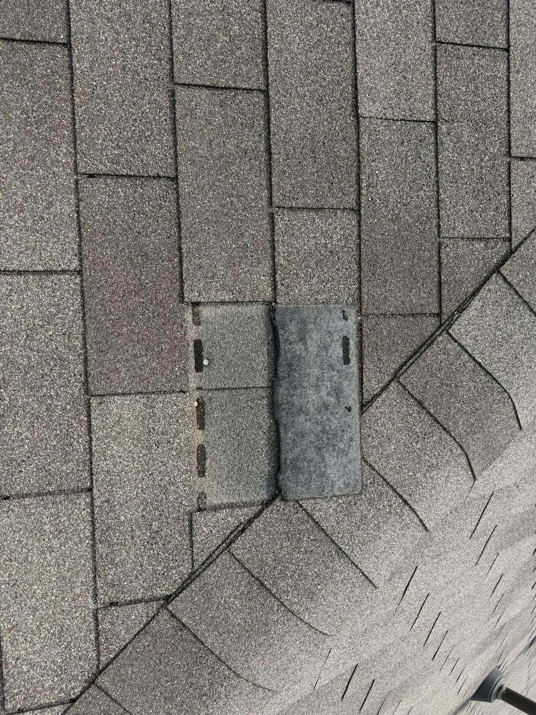 A piece of metal is sitting on top of a brick sidewalk.